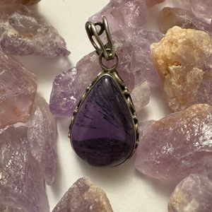 Purple stone set in sterling silver for pendant.
